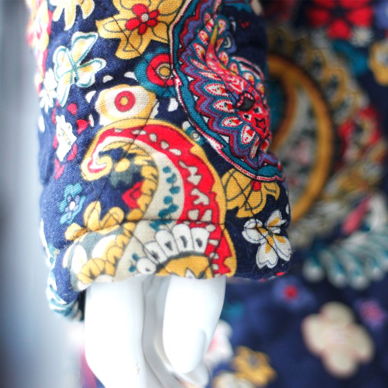 Áo khoác nữ chần bông dáng dài in hoa SMT